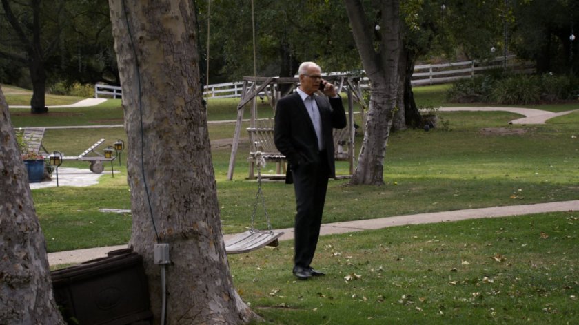 Octavian Bloom on phone in the yard of Bloom Estate Winery.