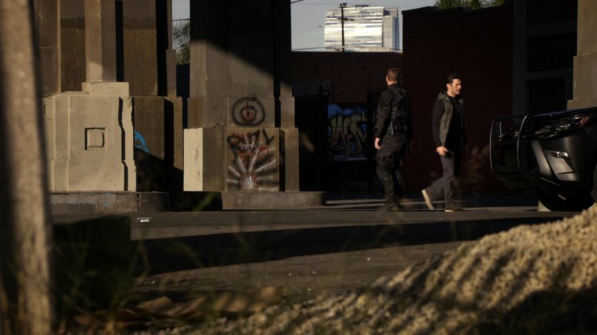 Bakshi and Hunter standing underneath a bridge.