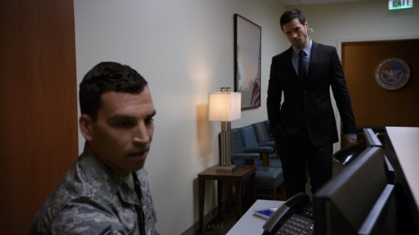 Ward and Air Force lieutenant at Air Force offices front desk.
