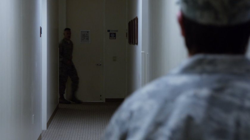 Glenn Talbot in hallway at Air Force offices.