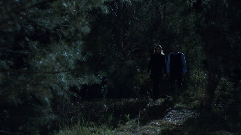 Bobbi and Agent Calderon in the woods outside Fury's cabin.