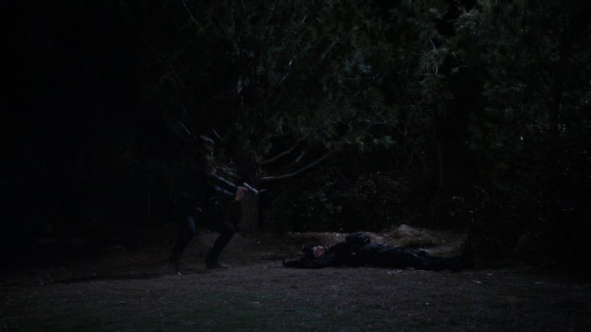 Bobbi and Agent Calderon in the woods outside Fury's cabin.