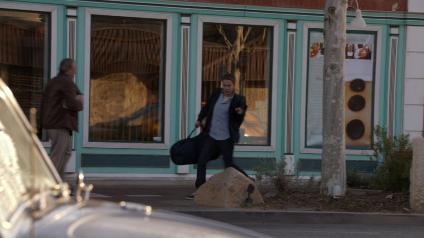 Fitz runs along a sidewalk in Delaware.