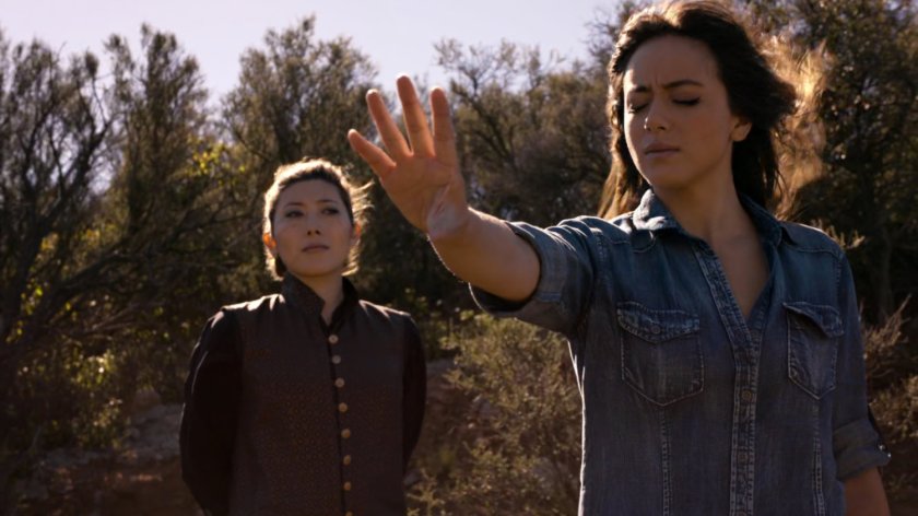 Jiaying and Skye on a hillside trail at Afterlife.