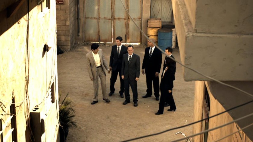 Coulson and other SHIELD agents on a dirt street in Bahrain.