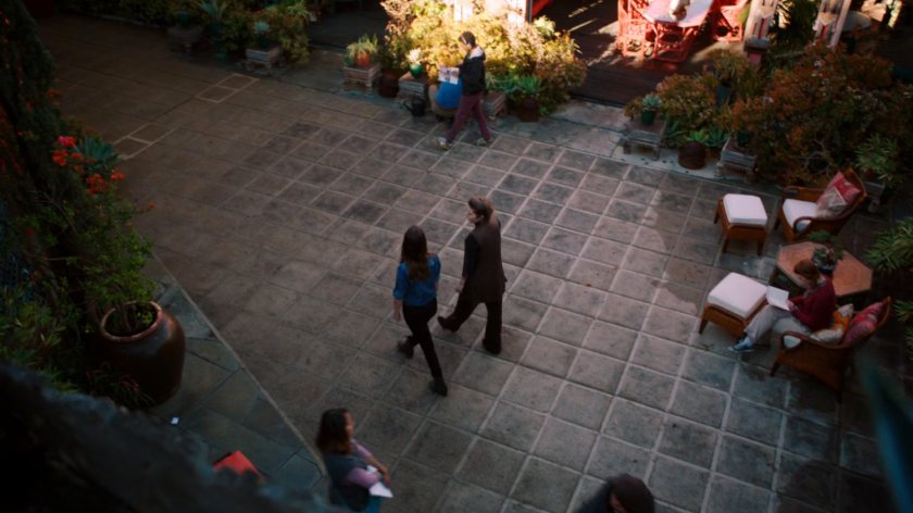 Jiaying and Skye walking through courtyard in Afterlife.