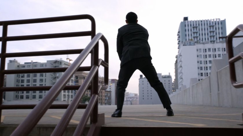 Man on parking garage roof deck.