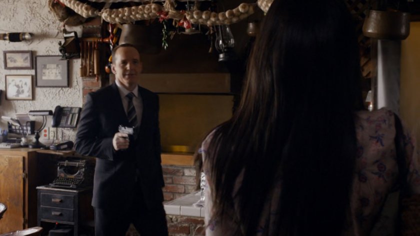 Coulson pulls a gun on Agent 33 in Mexican cantina.