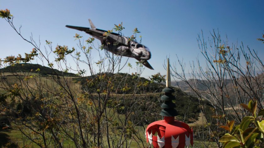 Quinjet flies past Afterlife.