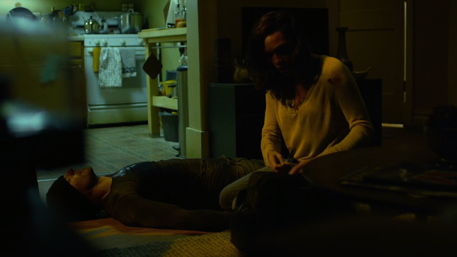 Matt and Claire inside her apartment.