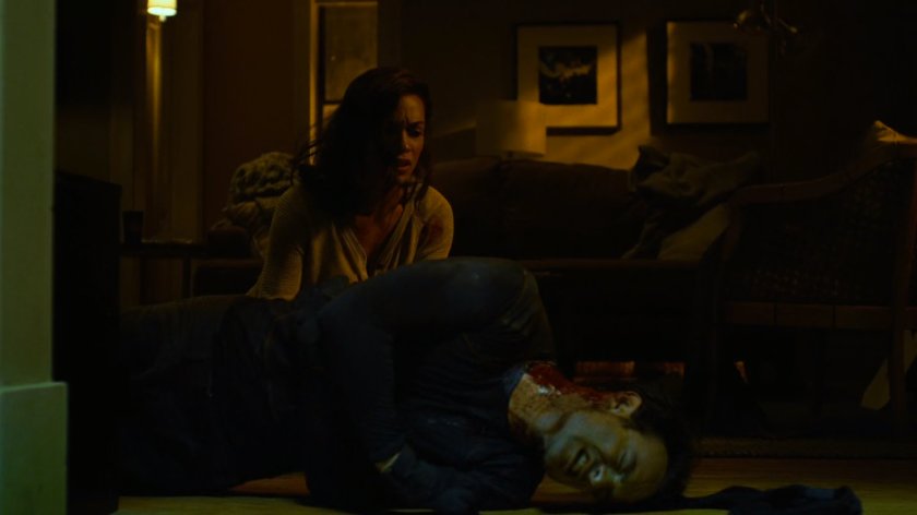 Matt and Claire inside her apartment.