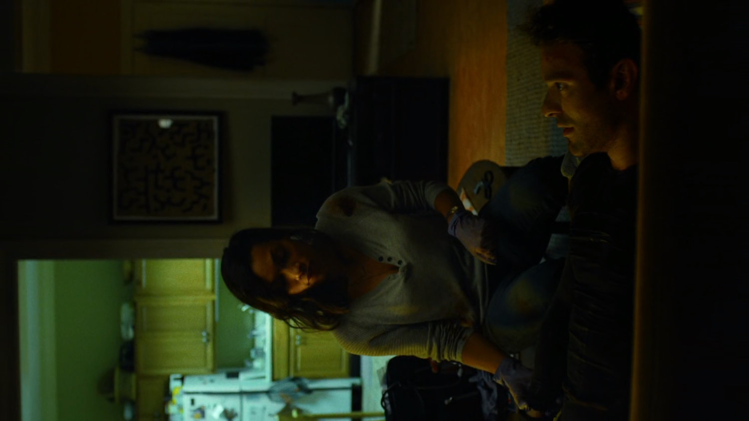 Matt and Claire inside her apartment.