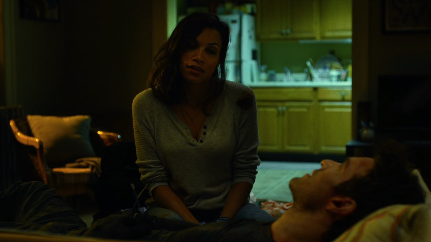Matt and Claire inside her apartment.