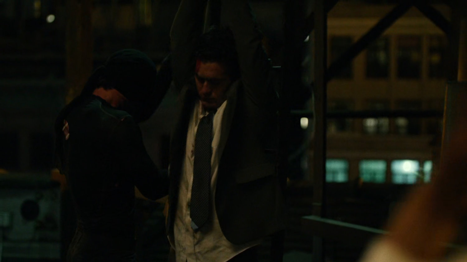 Matt interrogates mobster on rooftop of Claire's Apartment building.