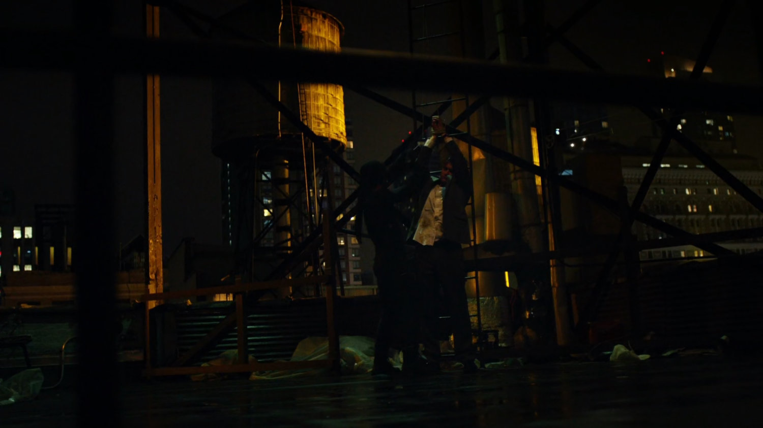 Matt interrogates mobster on rooftop of Claire's Apartment building.