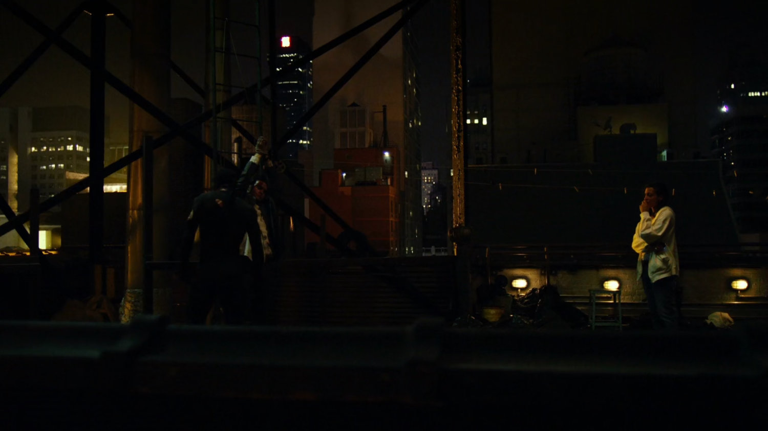Matt interrogates mobster on rooftop of Claire's Apartment building.