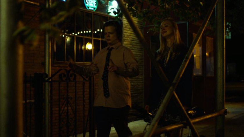 Foggy & Karen walk on sidewalk at night.