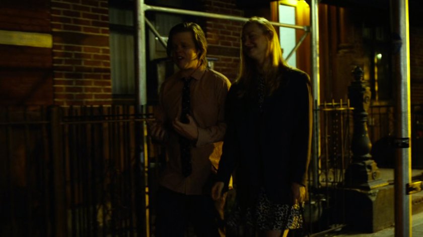 Foggy & Karen walk on sidewalk at night.