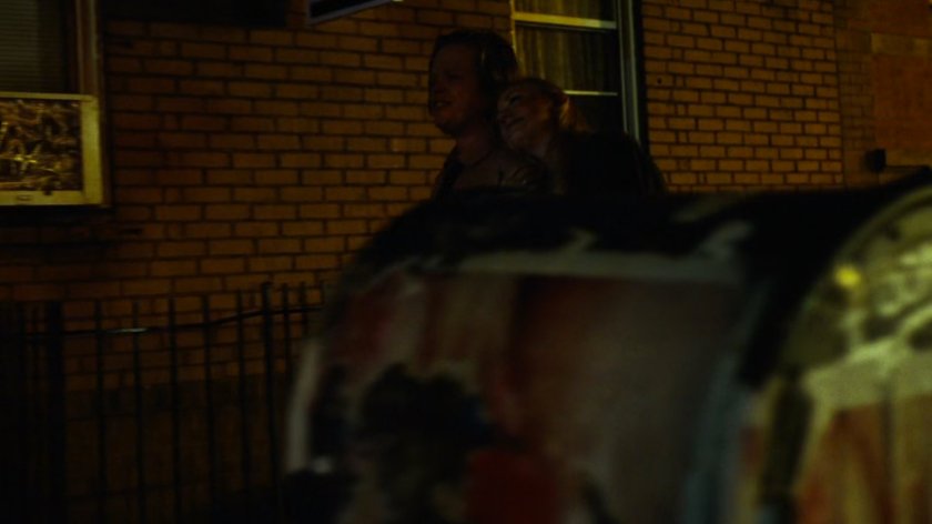 Foggy & Karen walk on sidewalk at night.