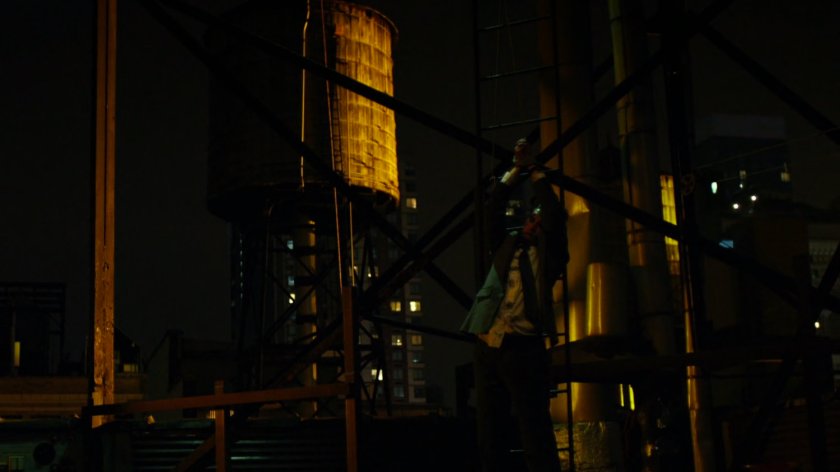 Matt interrogates mobster on rooftop of Claire's Apartment building.