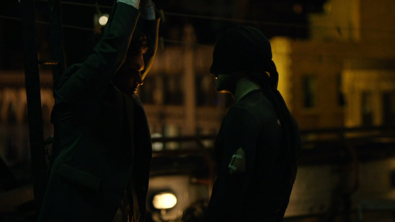 Matt interrogates mobster on rooftop of Claire's Apartment building.