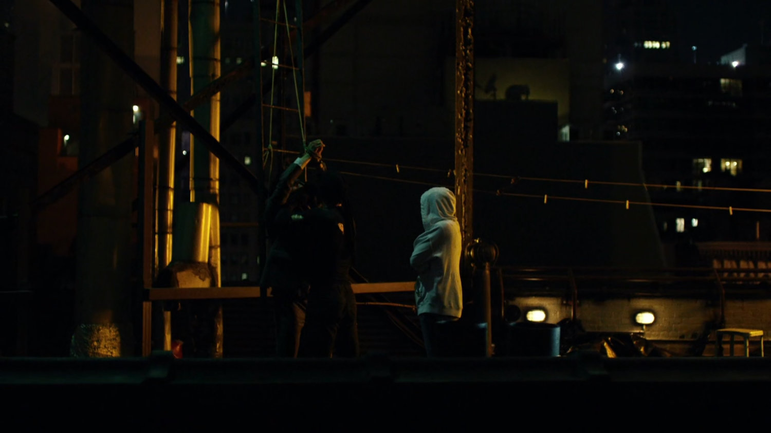 Matt interrogates mobster on rooftop of Claire's Apartment building.