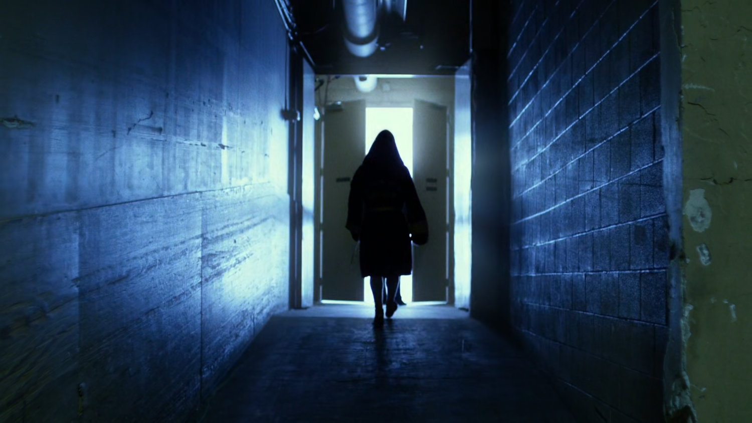 Jack Murdock in hallway of boxing arena.