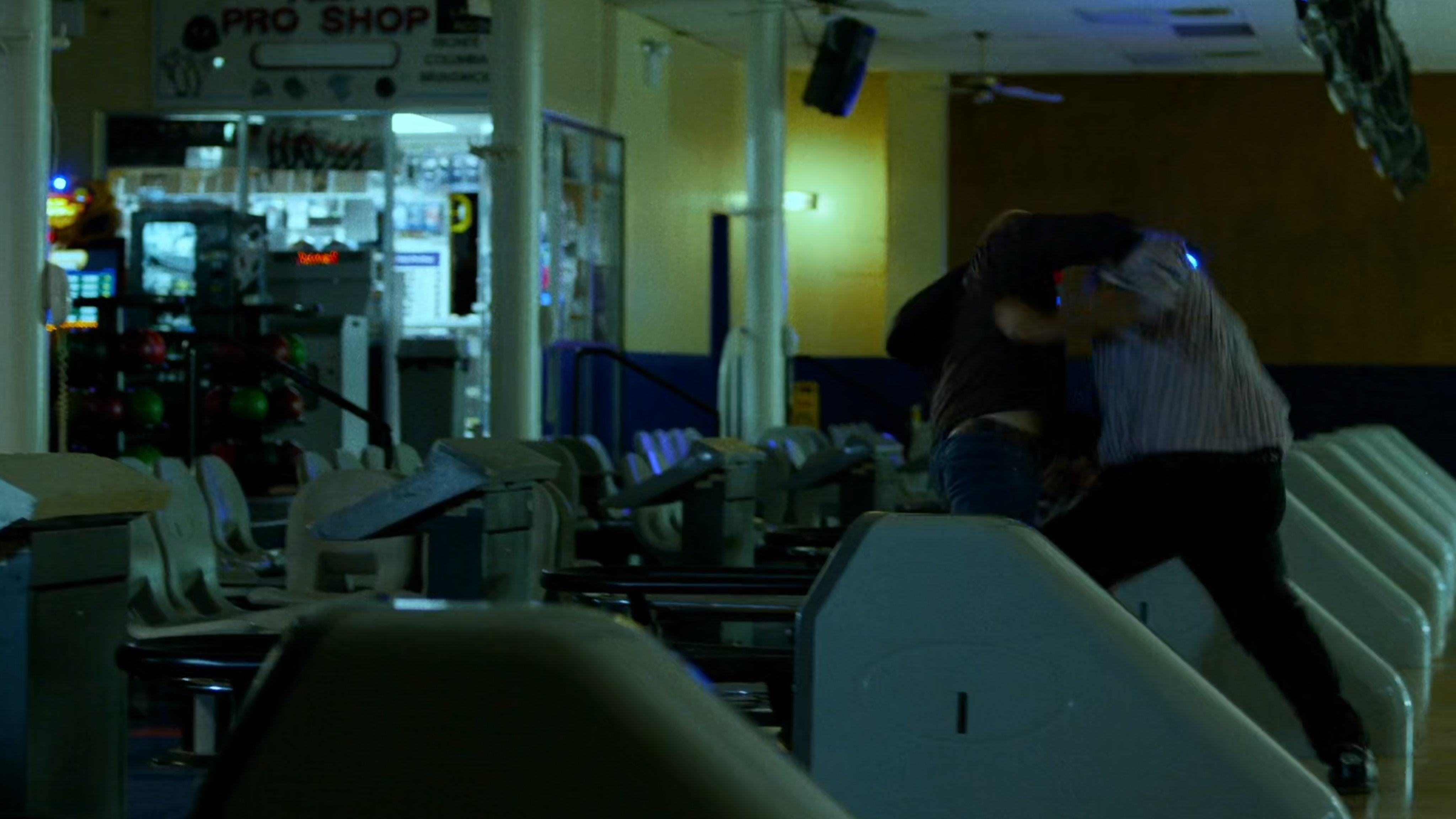 Men fight inside Whitestone Bowling Lanes.