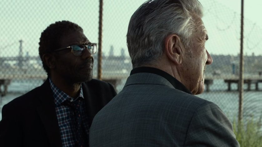 Ben and Silvio talk in river side lot.