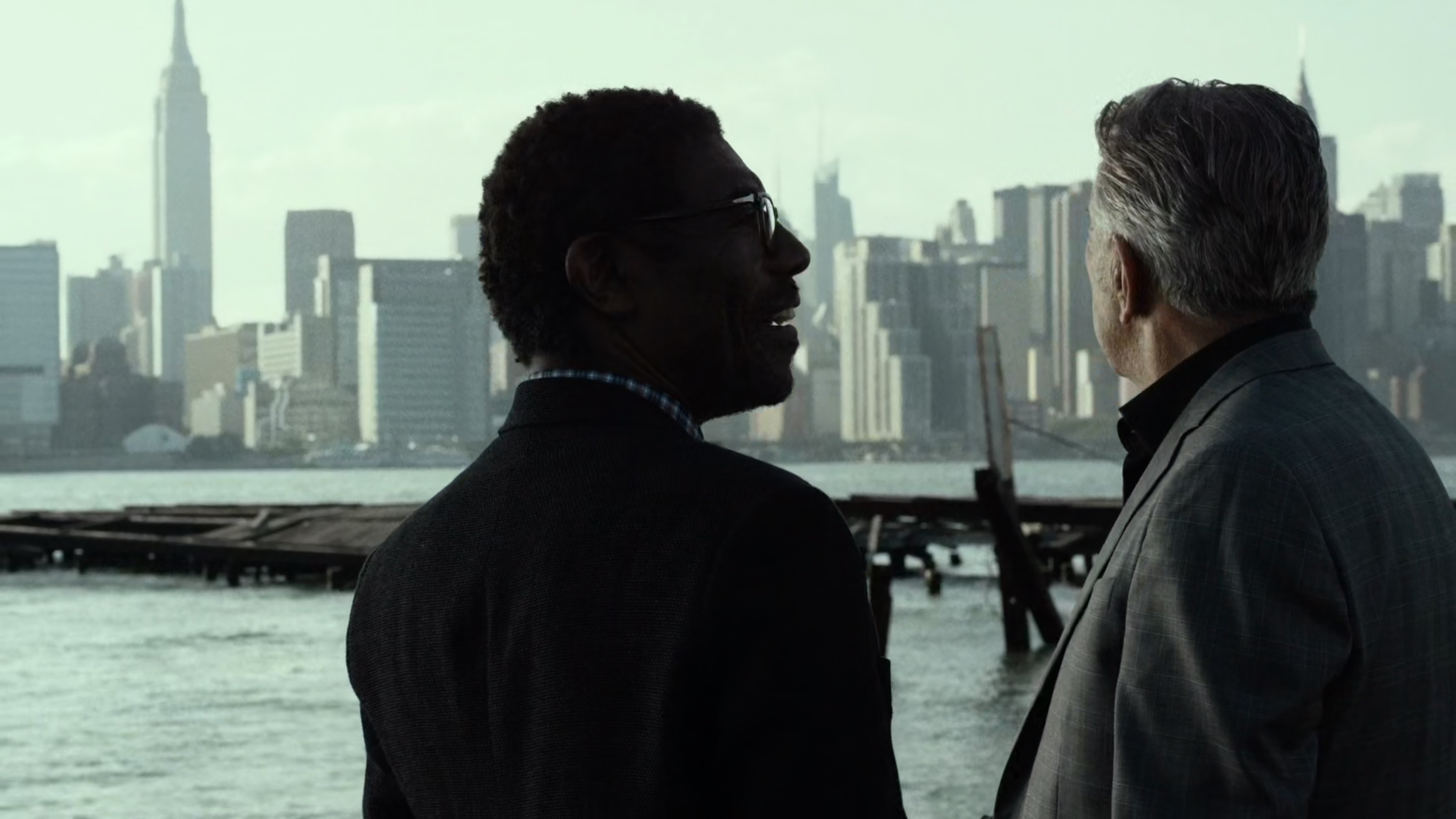 Ben and Silvio talk in river side lot.