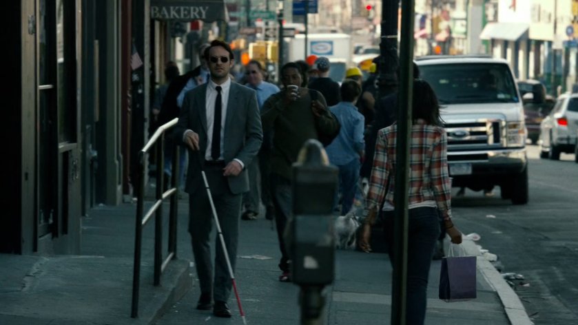 Matt follows Wesley along crowded sidewalk.