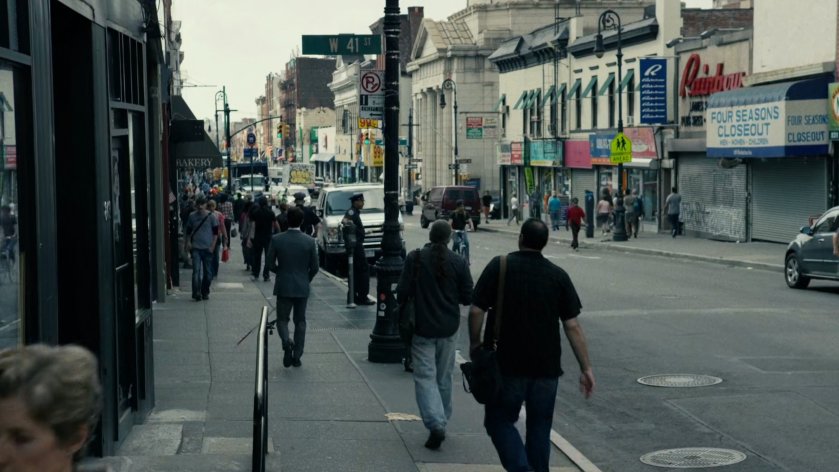Matt walks away on New York sidewalk.