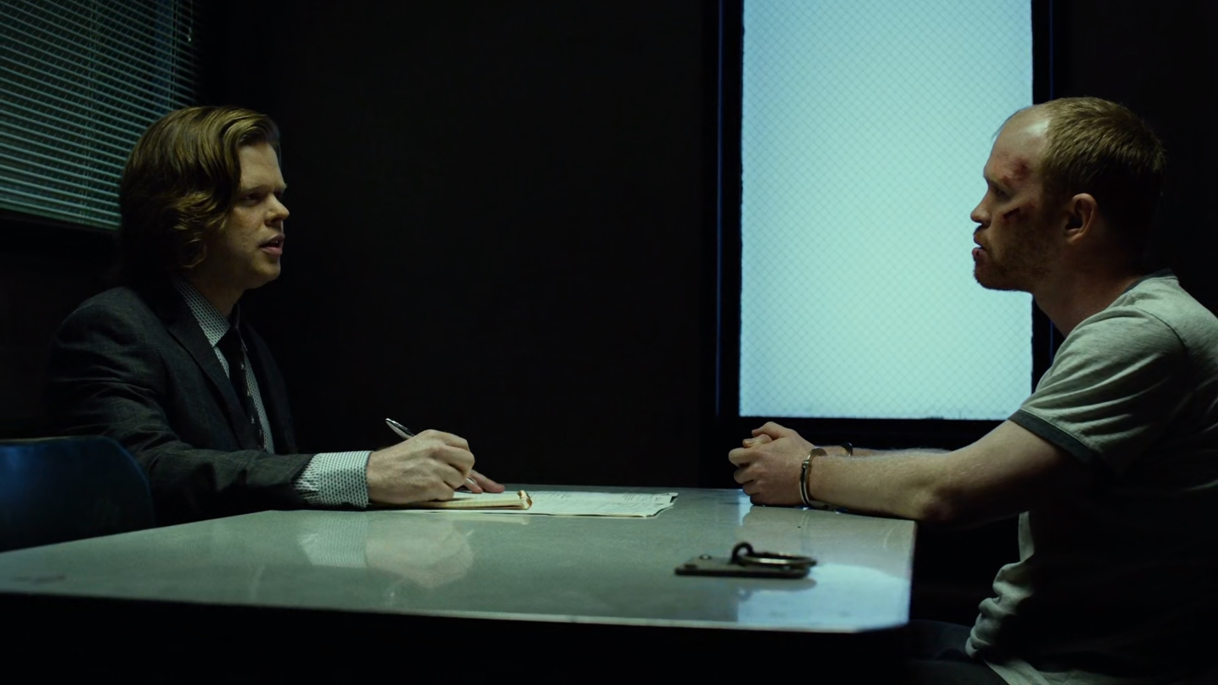 Foggy interviews Healy in interrogation room.