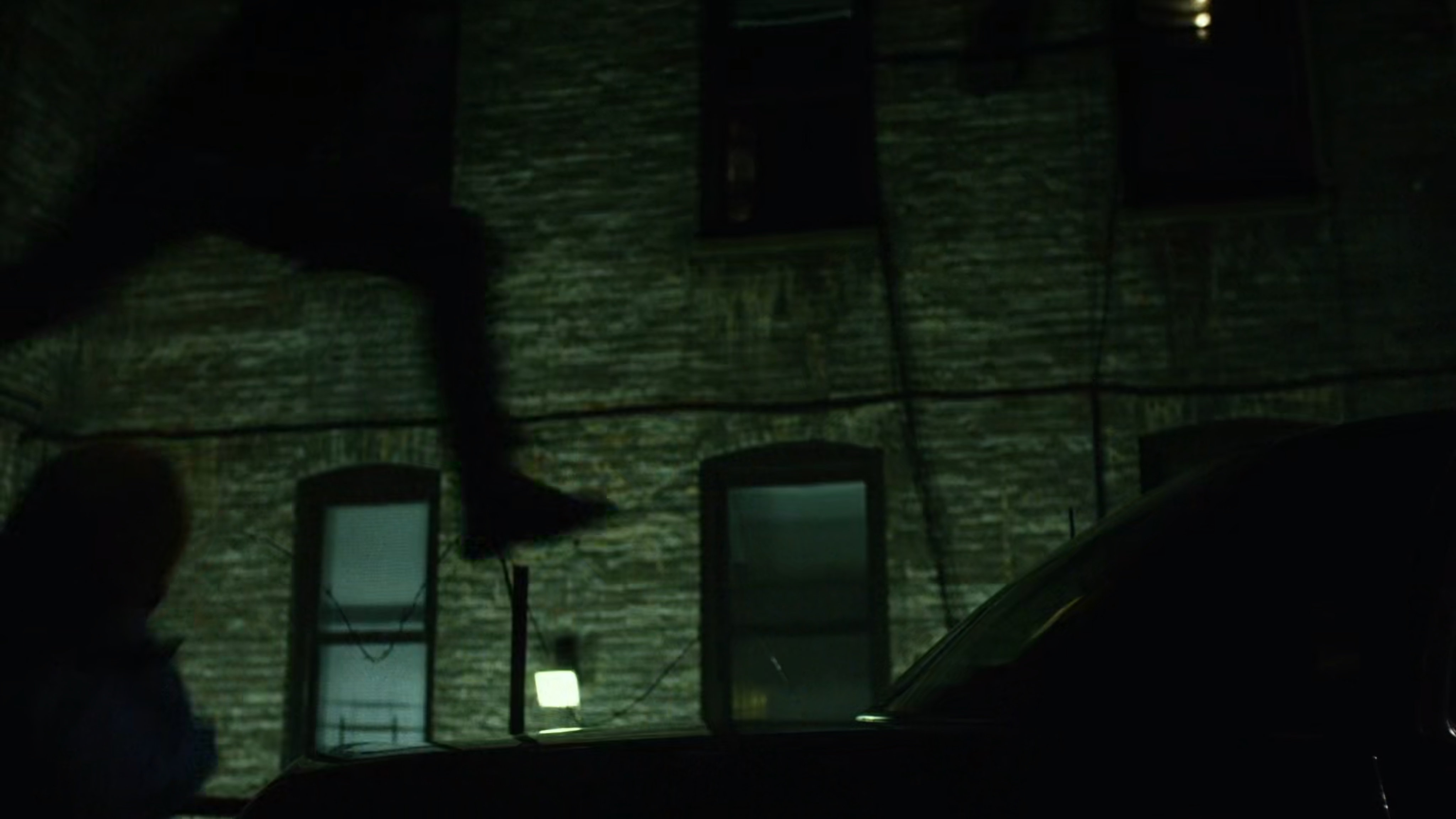 Daredevil fights Healy in dark alley.