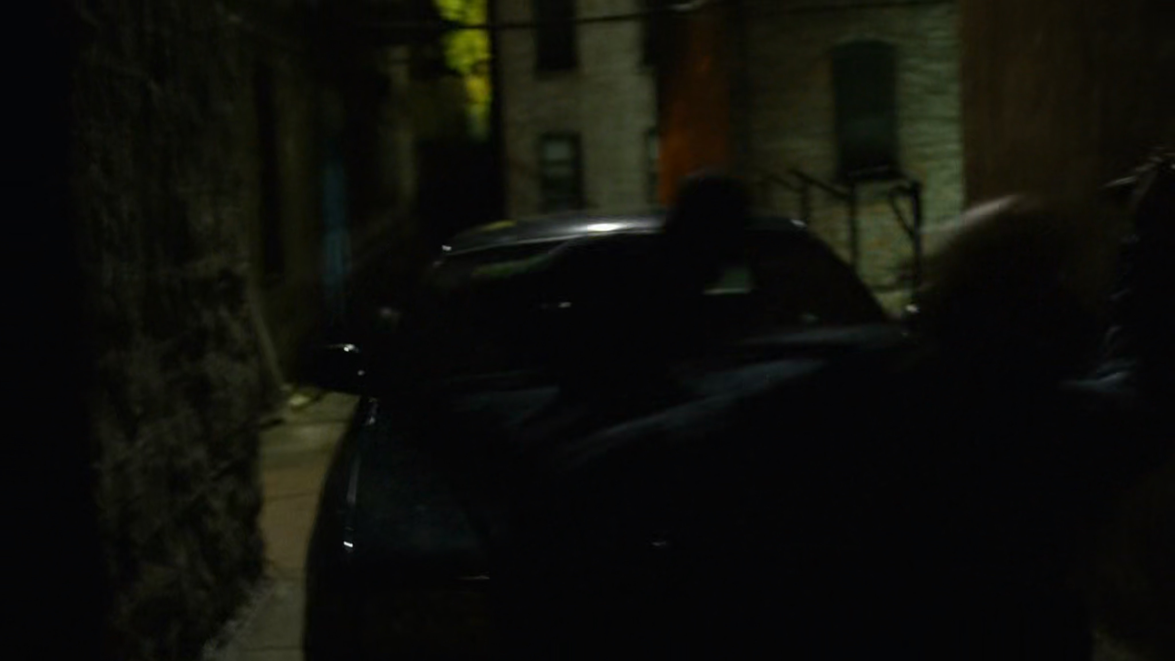 Daredevil fights Healy in dark alley.