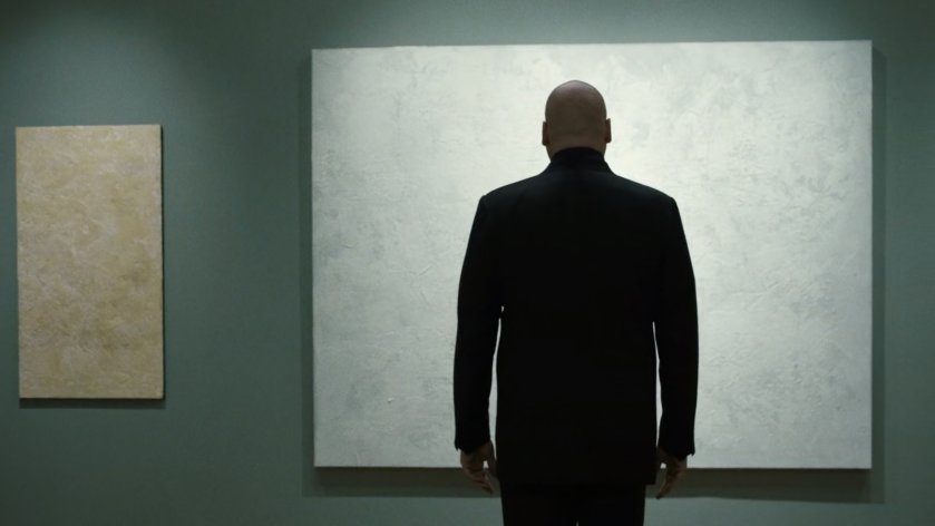 Wilson Fisk staring at artwork in gallery.
