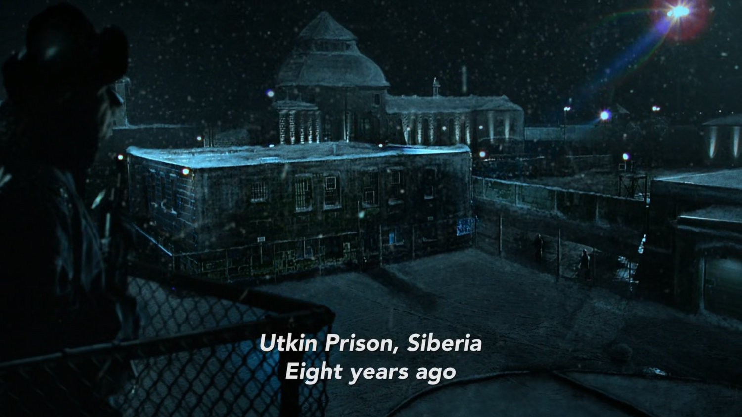 Dark snowy prison in Siberia. Text: Utkin Prison, Siberia. 8 years ago.