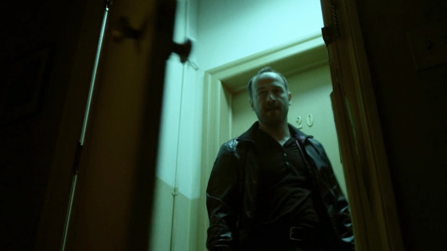 Russian mobster opens door to Claire's Apartment.