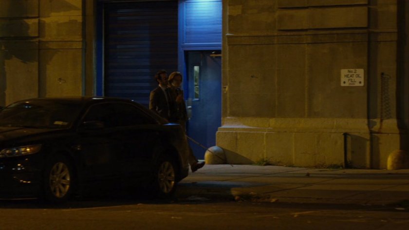 Matt and Foggy on sidewalk outside of 15th precinct at night.