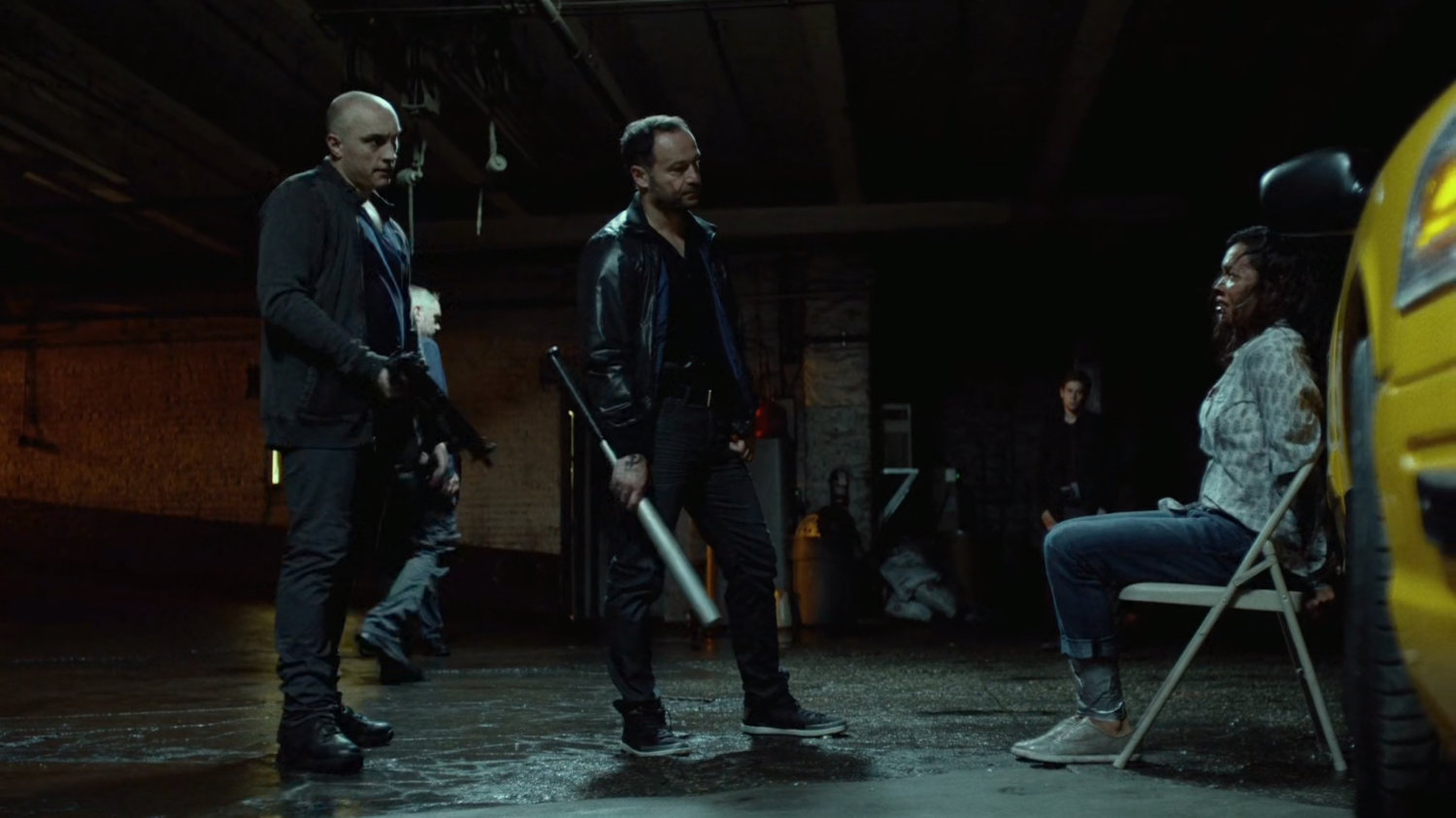 Russian mobsters threaten Claire with baseball bat.