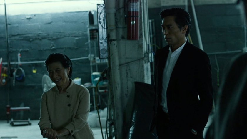 Madame Gao and Nobu in body shop garage.