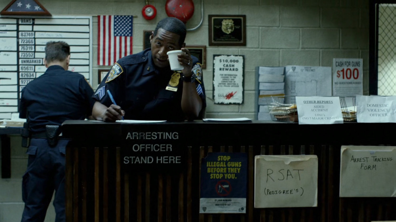 Officer Brett Mahoney at 15th Precinct front desk.