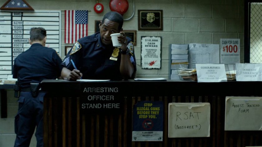 Officer Brett Mahoney at 15th Precinct front desk.