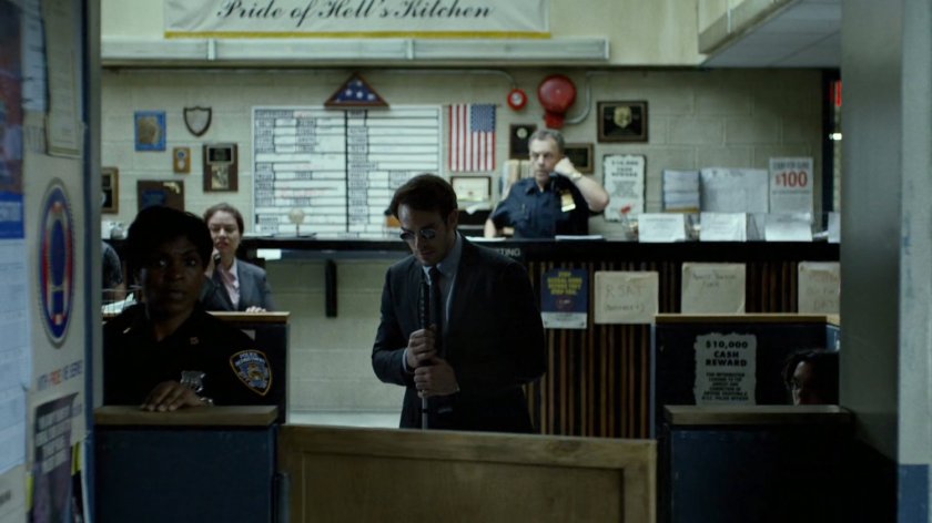 Matt and other officers by 15th Precinct front desk.