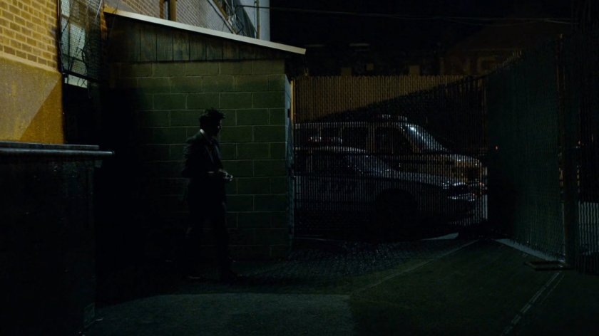 Detective Blake outside back door of 15th Precinct.