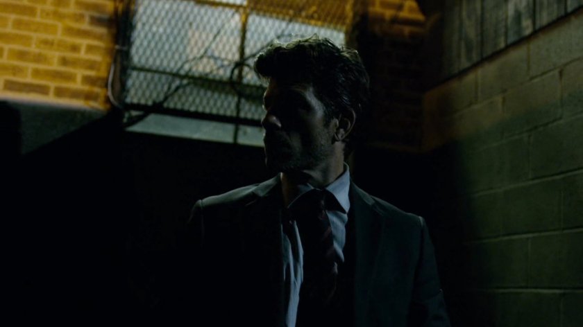 Detective Blake outside back door of 15th Precinct.