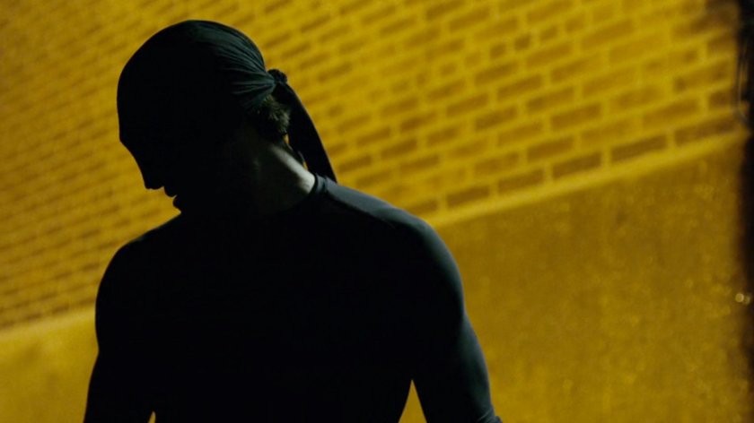 Daredevil outside back door of 15th Precinct.