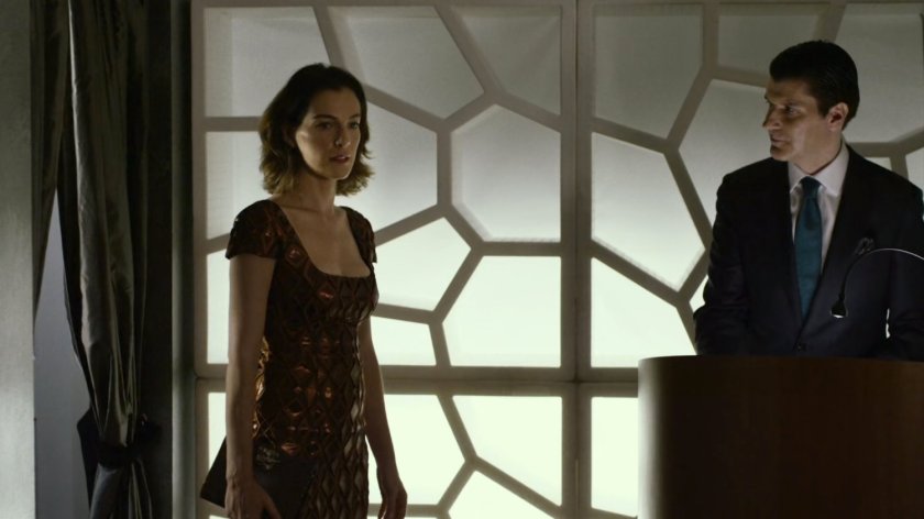 Vanessa enters Press Lounge restaurant.