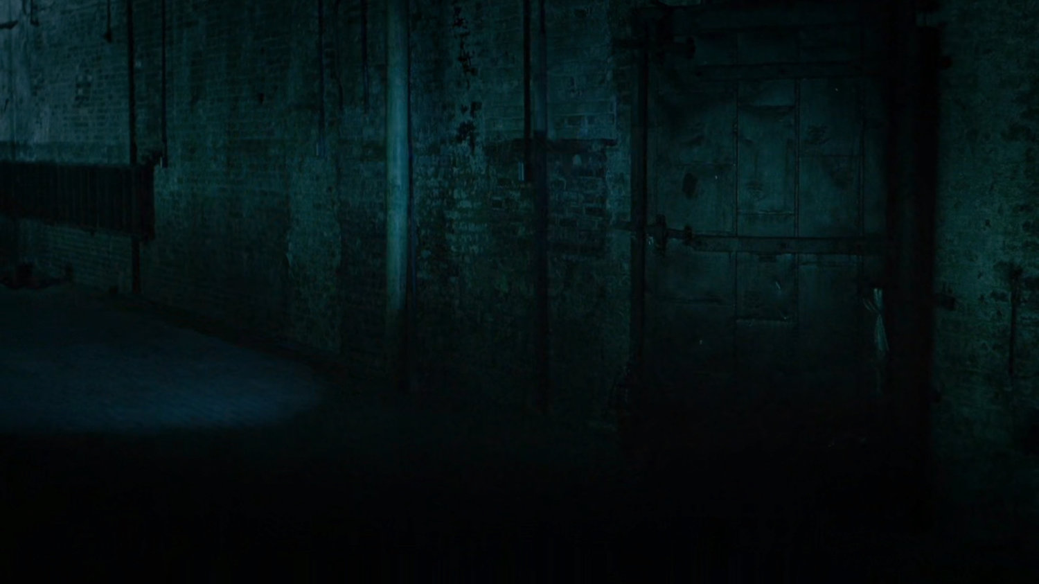 Police officer inside abandoned warehouse.