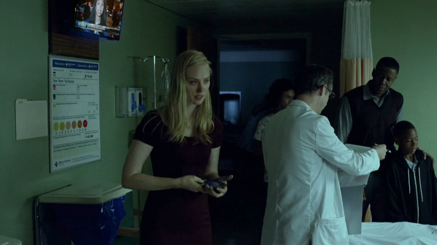 Karen inside Metro-General hospital room.